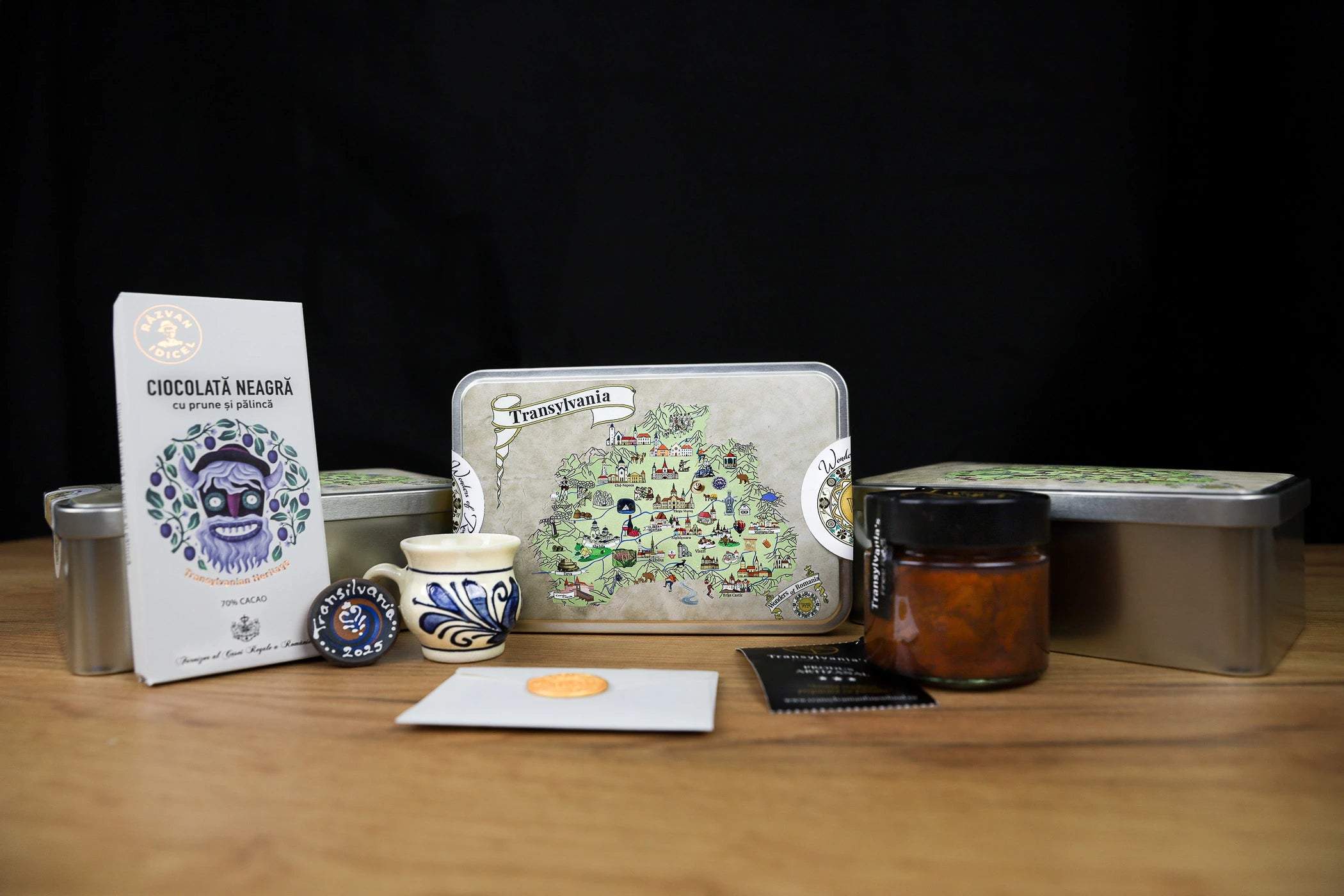 Collection of chocolate packaging and related items on a wooden surface with a dark background