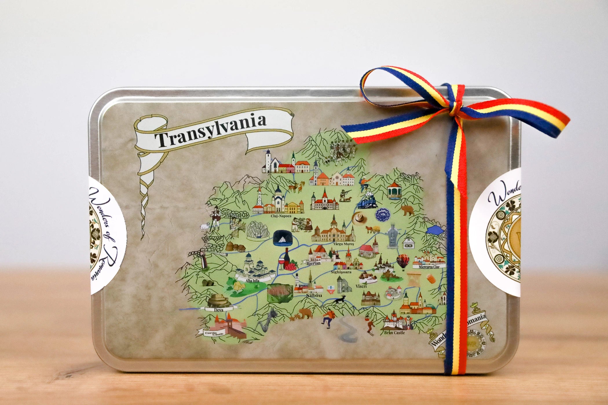Decorative tray with a map of Transylvania design, ribbon, and 'Transylvania' text on a light background.
